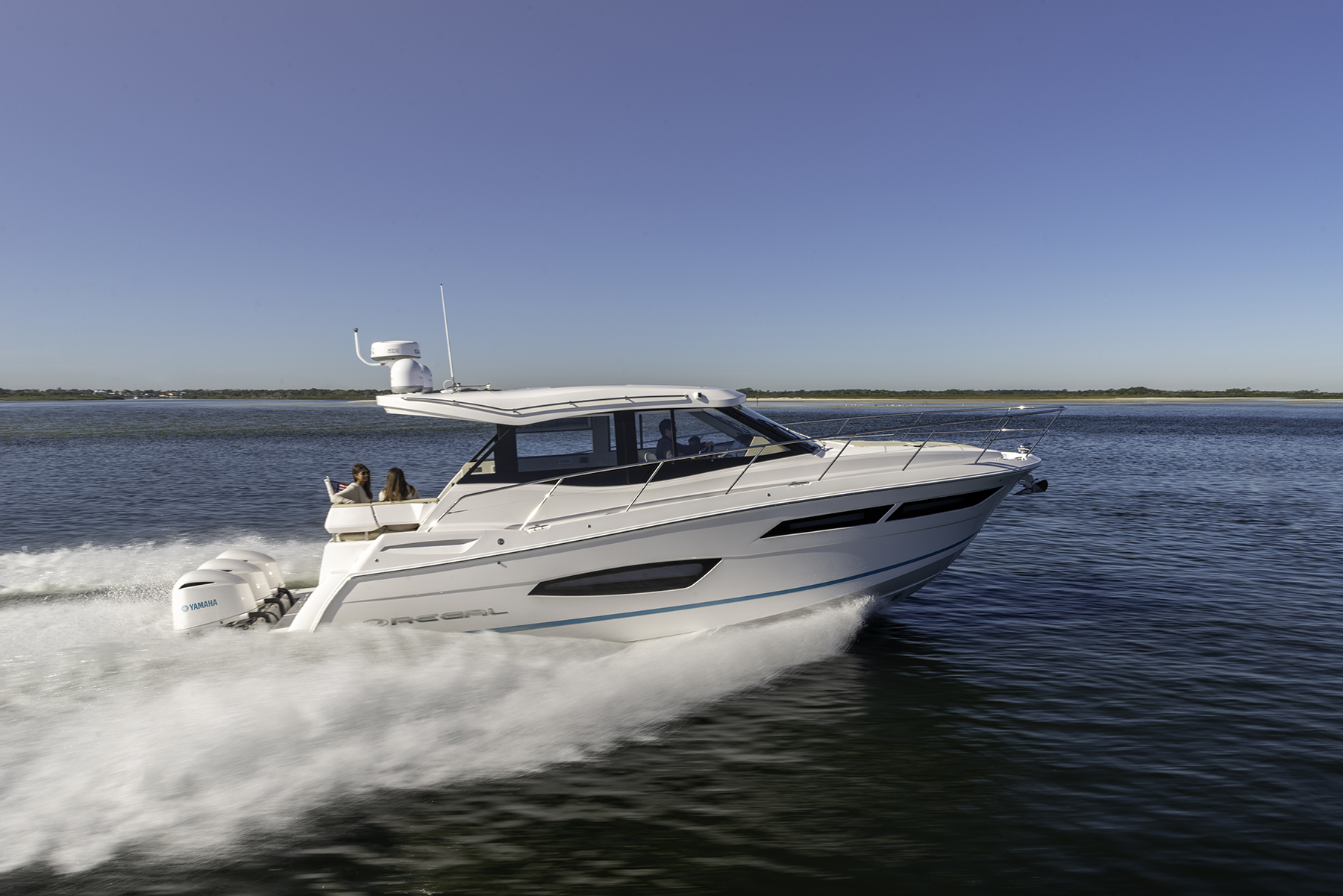 Regal day cruiser running offshore with twin Yamaha outboards